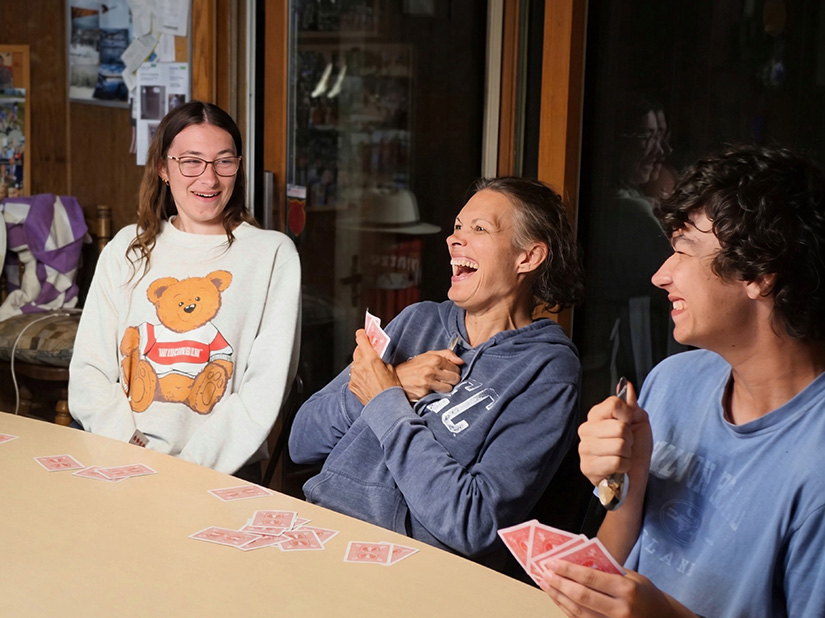 Emily, Rebecca, and Matthew Catozzi play spoons